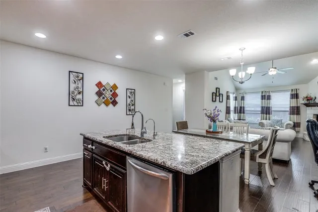 a view of a house with a yard and pathway