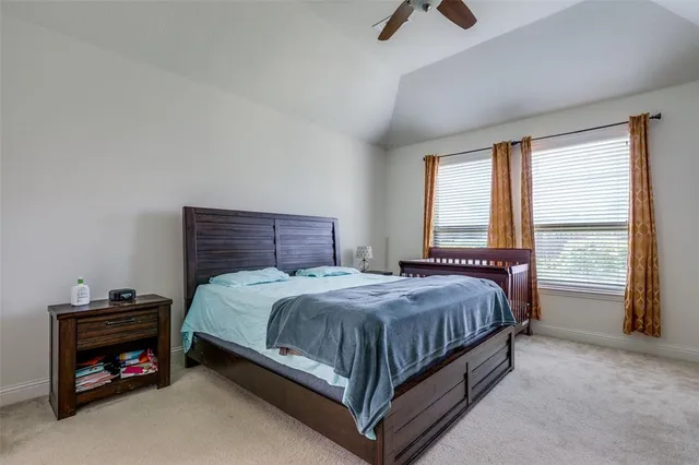 a kitchen with kitchen island granite countertop wooden floors white cabinets and stainless steel appliances