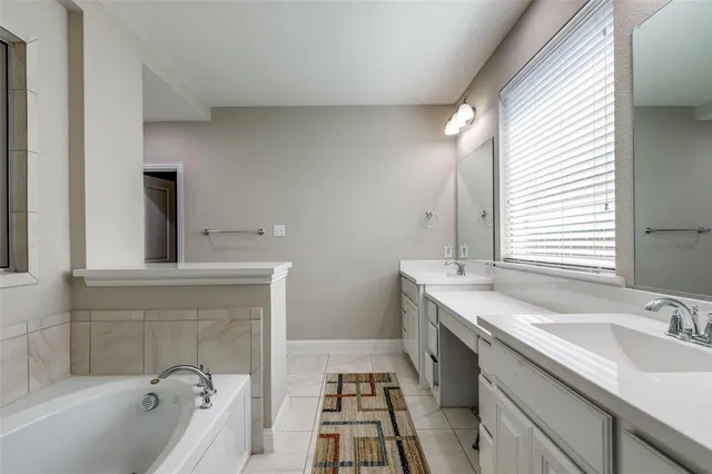 a bedroom with a bed and cabinets