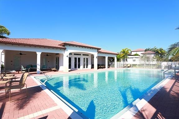 2825 Southwest 119th Way Miramar, FL 33025 - Photo 17 of 23 a view of swimming pool with lawn chairs and plants