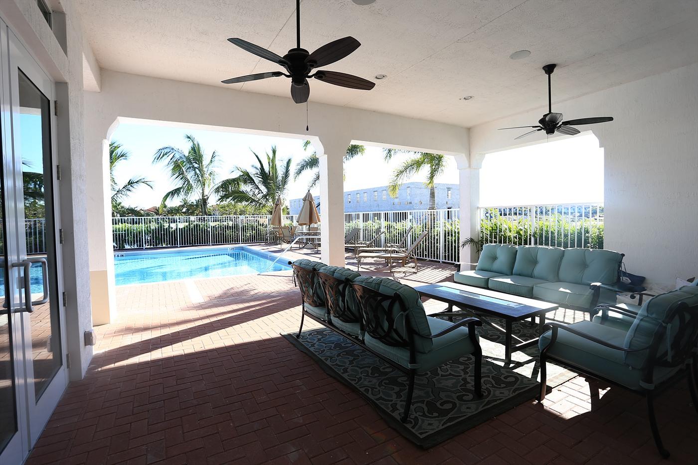 2825 Southwest 119th Way Miramar, FL 33025 - Photo 22 of 23 a living room with furniture and a floor to ceiling window
