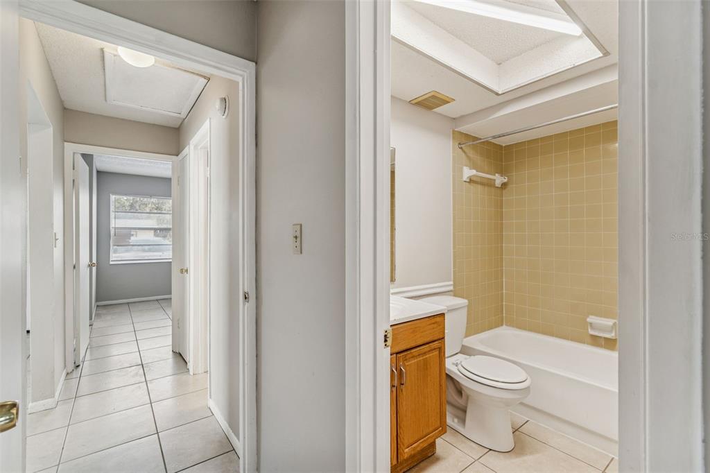 6024 Norton Road Lakeland, FL 33809 - Photo 27 of 56 a white toilet sitting next to a bathroom sink