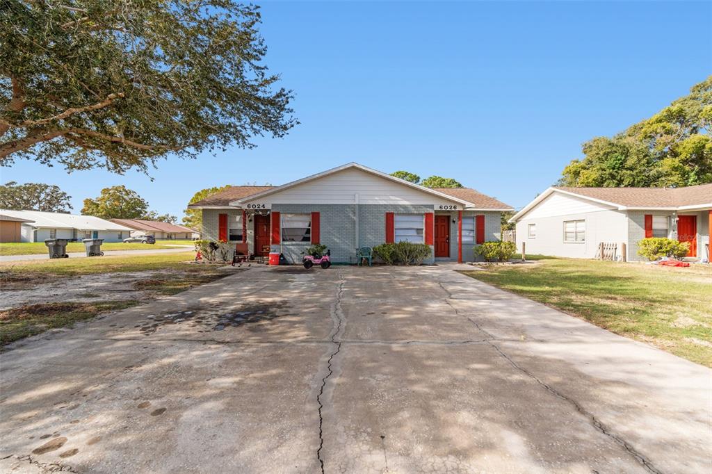 6024 Norton Road Lakeland, FL 33809 - Photo 9 of 56 a front view of a house with a yard and trees