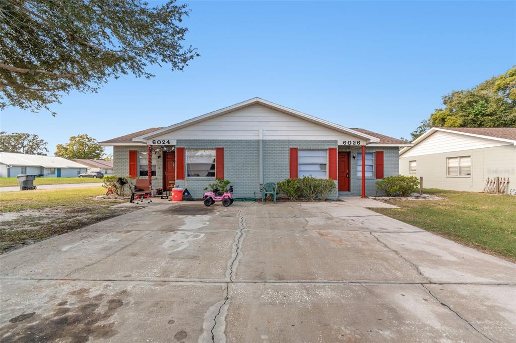 6024 Norton Road Lakeland, FL 33809 - Photo 10 of 56 a view of a house next to a yard and road