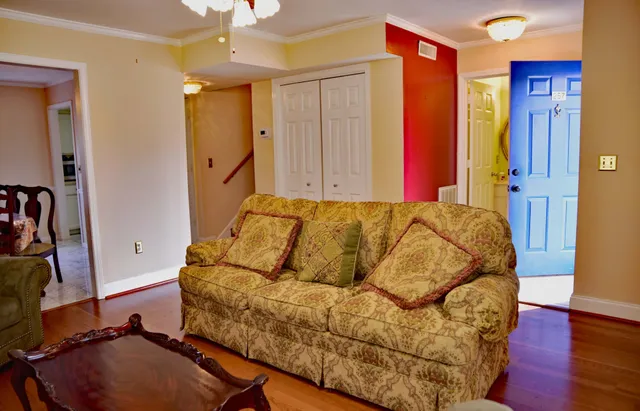 a living room with a bed and gym equipment