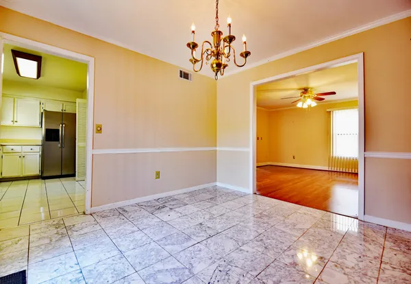 a view of a hallway with a chandelier