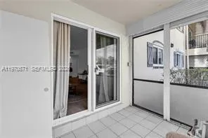 a view of a walk in closet and bathroom