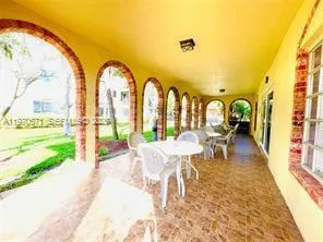 a view of swimming pool with outdoor seating