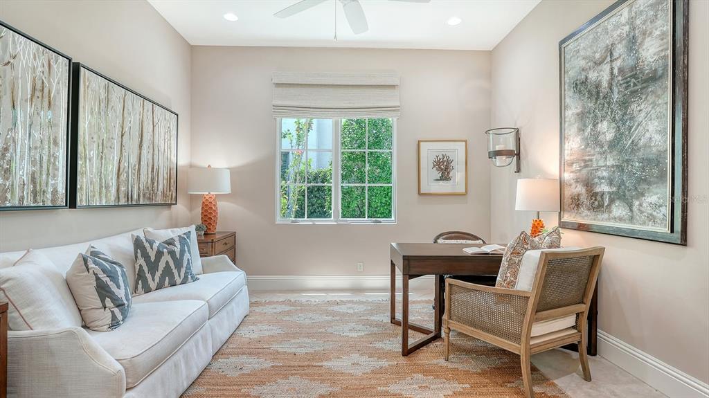 7975 Matera Court Lakewood Ranch, FL 34202 - Photo 16 of 83 a living room with furniture and a window