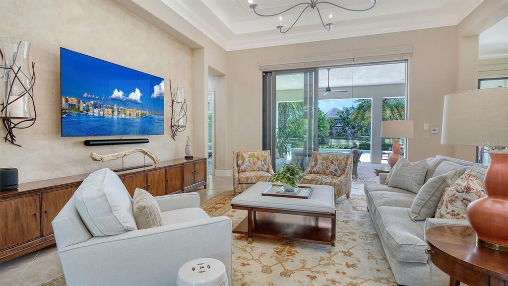 7975 Matera Court Lakewood Ranch, FL 34202 - Photo 18 of 83 a living room with furniture and a large window