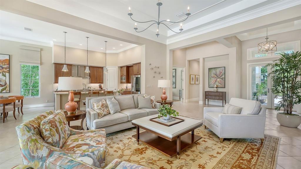 7975 Matera Court Lakewood Ranch, FL 34202 - Photo 20 of 83 a living room with furniture or couches and a potted plant