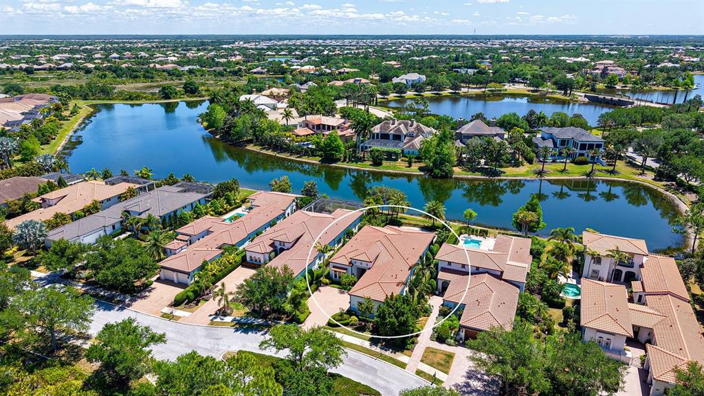 7975 Matera Court Lakewood Ranch, FL 34202 - Photo 2 of 83 an aerial view of residential houses with outdoor space