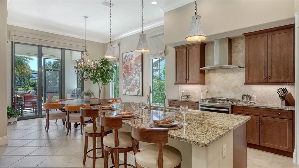 7975 Matera Court Lakewood Ranch, FL 34202 - Photo 21 of 83 a kitchen with granite countertop lots of counter top space