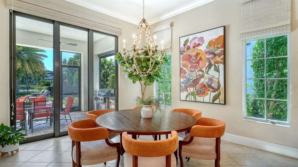 7975 Matera Court Lakewood Ranch, FL 34202 - Photo 22 of 83 a view of a dining room with furniture window and outside view