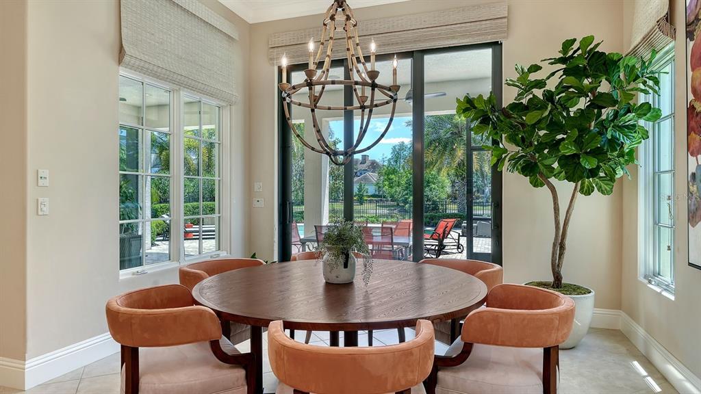 7975 Matera Court Lakewood Ranch, FL 34202 - Photo 23 of 83 a view of a dining room with furniture window and outside view