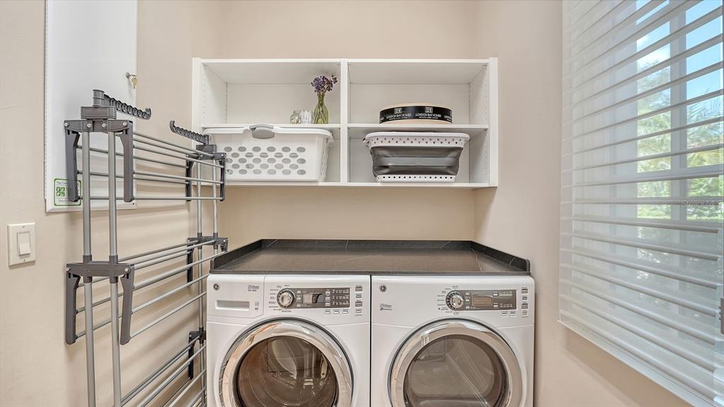 7975 Matera Court Lakewood Ranch, FL 34202 - Photo 41 of 83 a utility room with closet dryer and washer