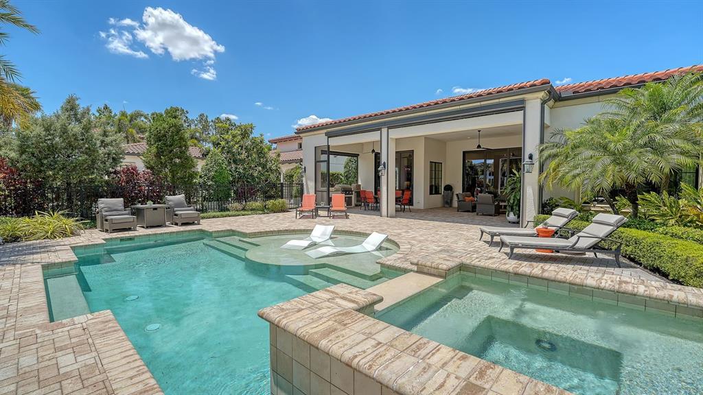 7975 Matera Court Lakewood Ranch, FL 34202 - Photo 49 of 83 a view of a house with swimming pool and sitting area