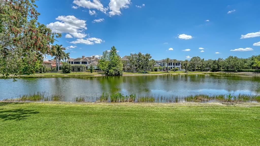7975 Matera Court Lakewood Ranch, FL 34202 - Photo 55 of 83 a view of a lake with houses in the background