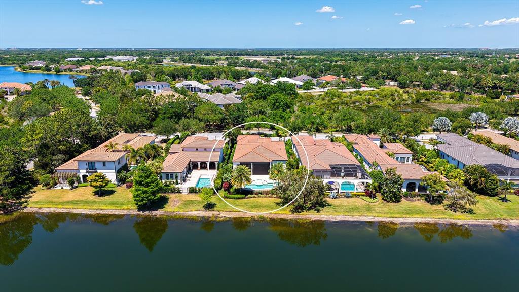 7975 Matera Court Lakewood Ranch, FL 34202 - Photo 58 of 83 an aerial view of residential houses with outdoor space and swimming pool