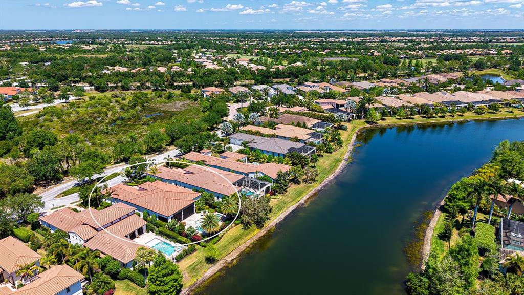 7975 Matera Court Lakewood Ranch, FL 34202 - Photo 59 of 83 an aerial view of residential houses with outdoor space and river