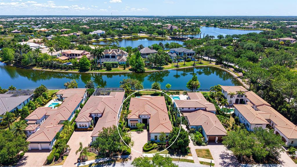 7975 Matera Court Lakewood Ranch, FL 34202 - Photo 60 of 83 an aerial view of lake residential house with outdoor space and river view