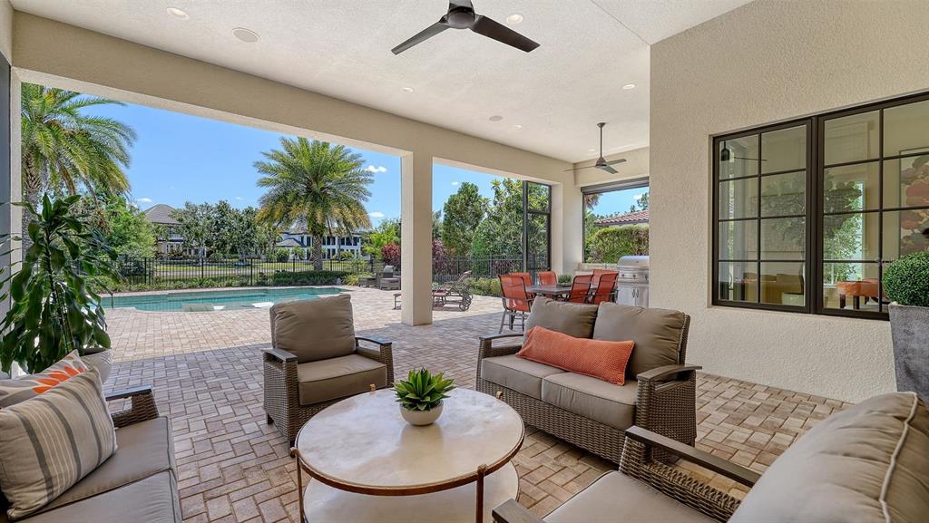 7975 Matera Court Lakewood Ranch, FL 34202 - Photo 6 of 83 a living room with furniture and a large window