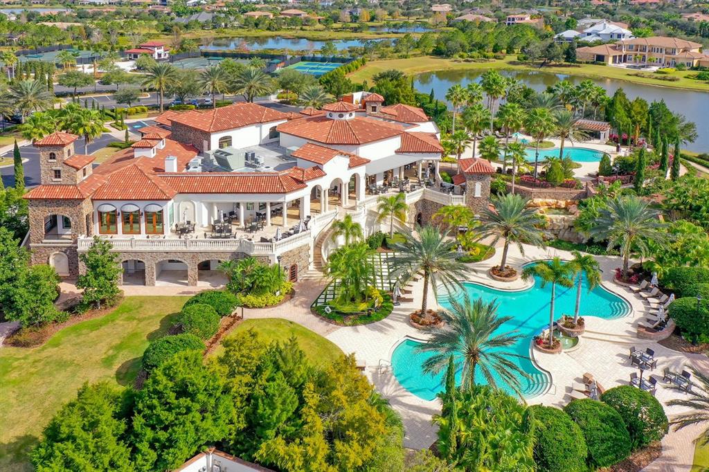 7975 Matera Court Lakewood Ranch, FL 34202 - Photo 62 of 83 an aerial view of residential houses with outdoor space and trees
