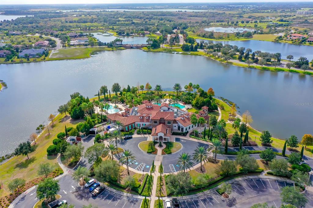 7975 Matera Court Lakewood Ranch, FL 34202 - Photo 63 of 83 an aerial view of lake residential house with swimming pool and green space