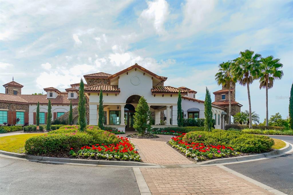 7975 Matera Court Lakewood Ranch, FL 34202 - Photo 65 of 83 a front view of a house with a garden