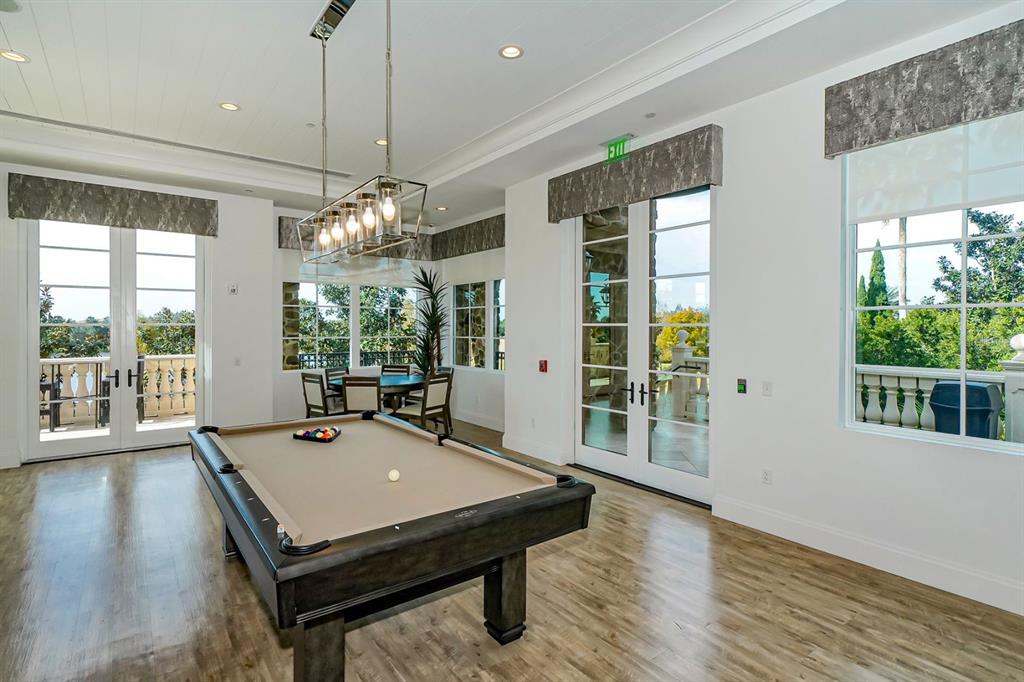7975 Matera Court Lakewood Ranch, FL 34202 - Photo 70 of 83 a room with pool table and windows