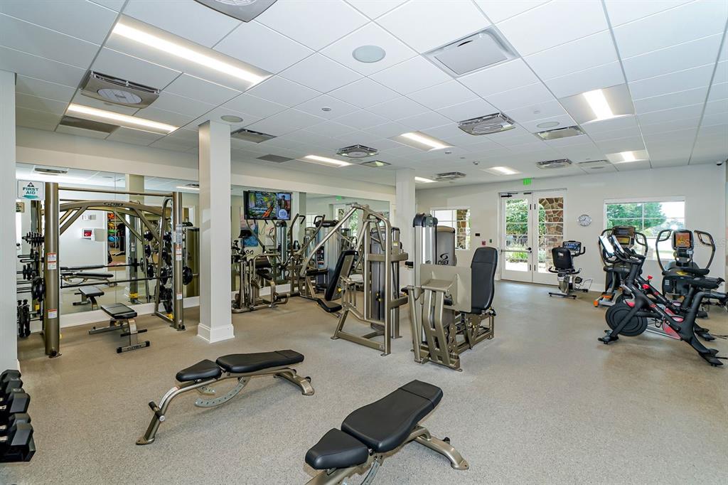 7975 Matera Court Lakewood Ranch, FL 34202 - Photo 73 of 83 a view of a room with gym equipment