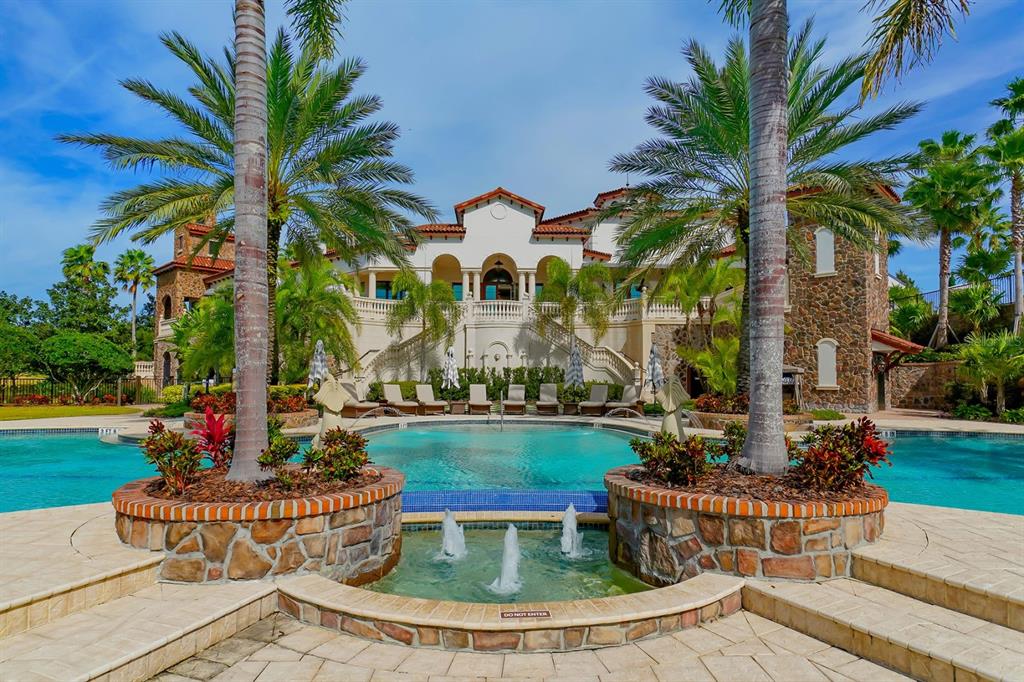 7975 Matera Court Lakewood Ranch, FL 34202 - Photo 78 of 83 a view of a house with swimming pool and porch with furniture