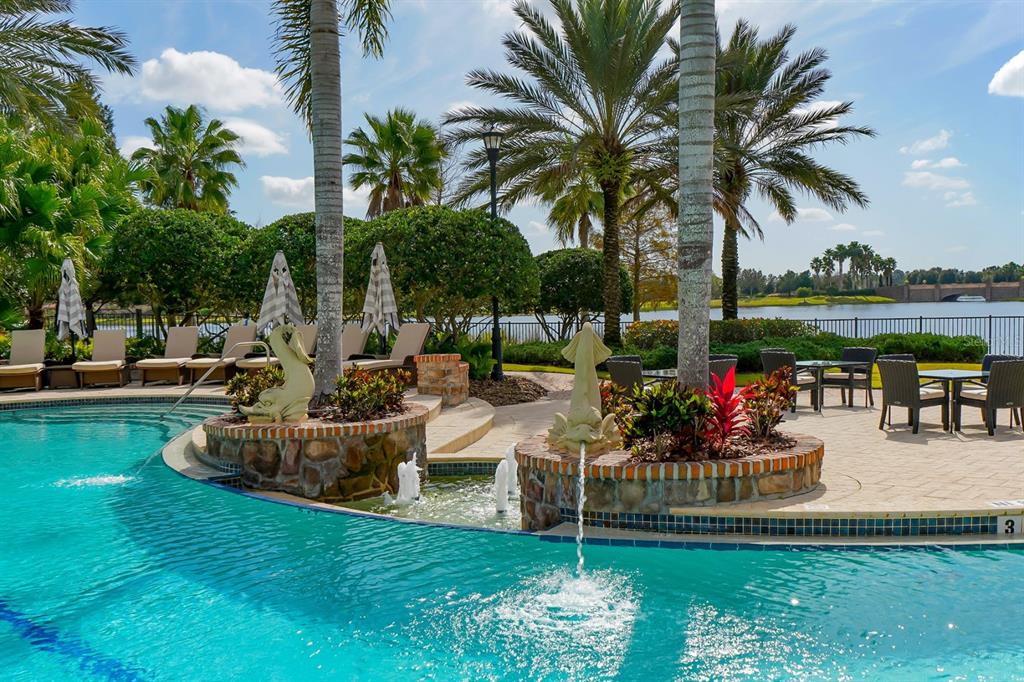 7975 Matera Court Lakewood Ranch, FL 34202 - Photo 79 of 83 a view of a swimming pool and lounge chair