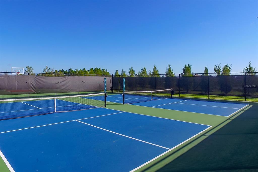 7975 Matera Court Lakewood Ranch, FL 34202 - Photo 82 of 83 a view of an outdoor space and tennis court