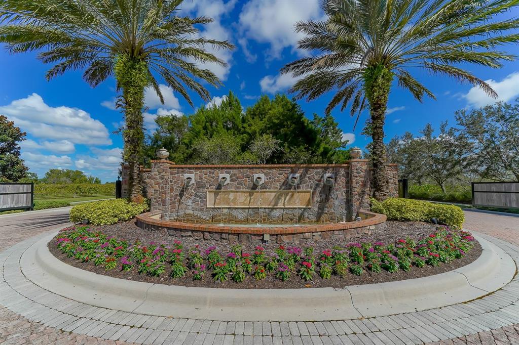 7975 Matera Court Lakewood Ranch, FL 34202 - Photo 83 of 83 a view of a garden with a fountain