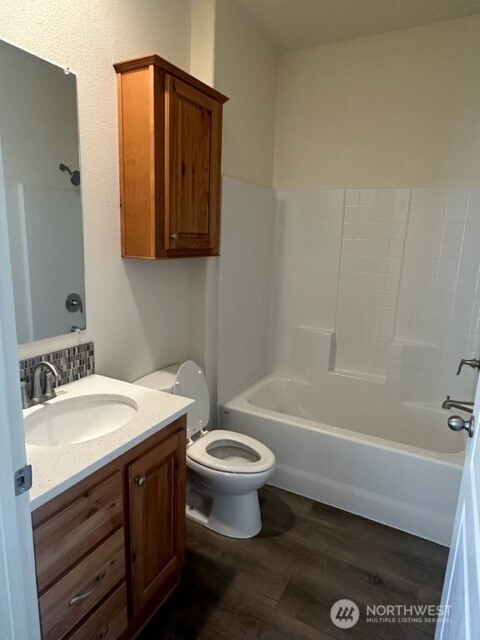 2101 South 324th Street, Unit 228 Federal Way, WA 98003 - Photo 8 of 11 a bathroom with a sink a toilet and shower