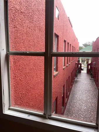 a view of a balcony with wooden floor