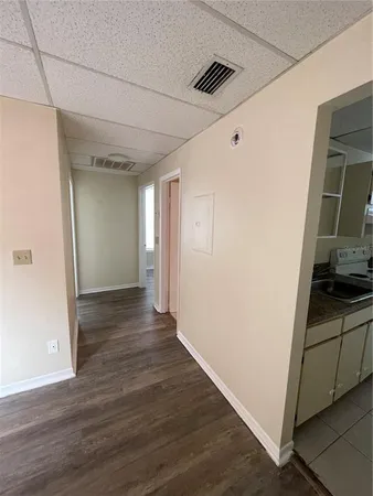 a view of hallway with wooden floor