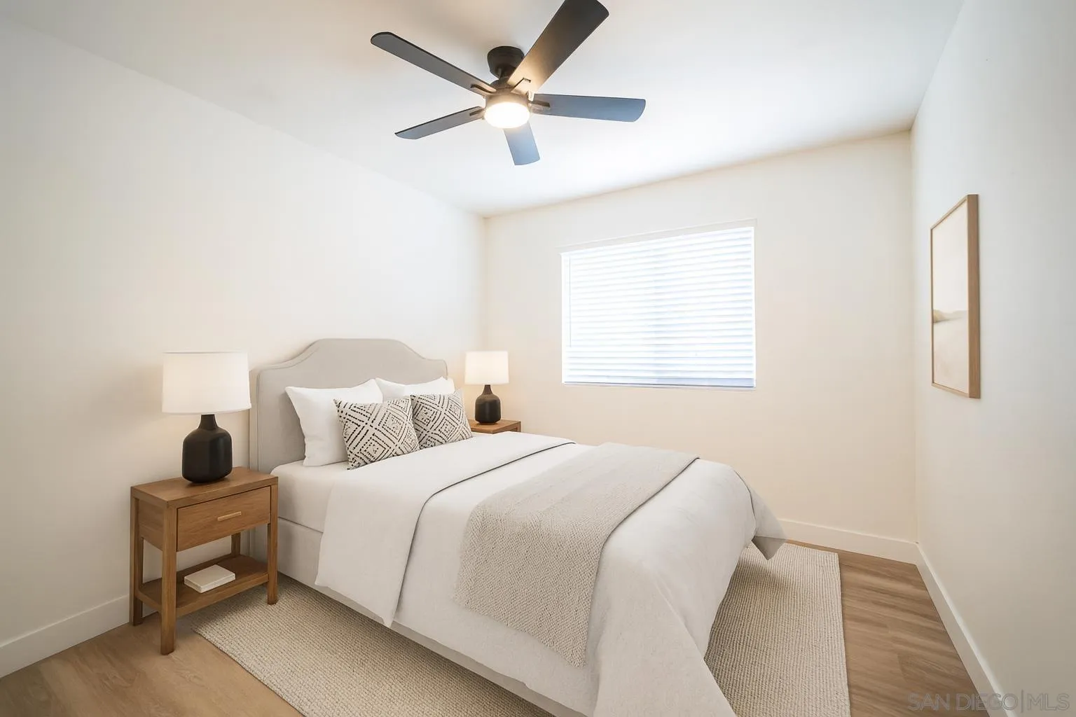 1306 West San Ysidro Boulevard, Unit D San Diego, CA 92173 - Photo 22 of 22 a bedroom with bed and window