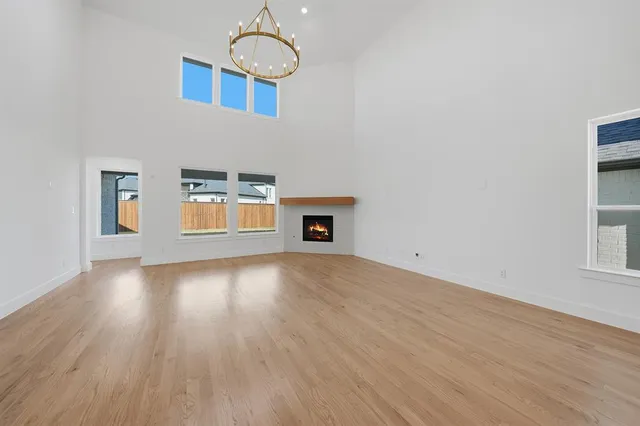 a view of a livingroom with wooden floor and a window