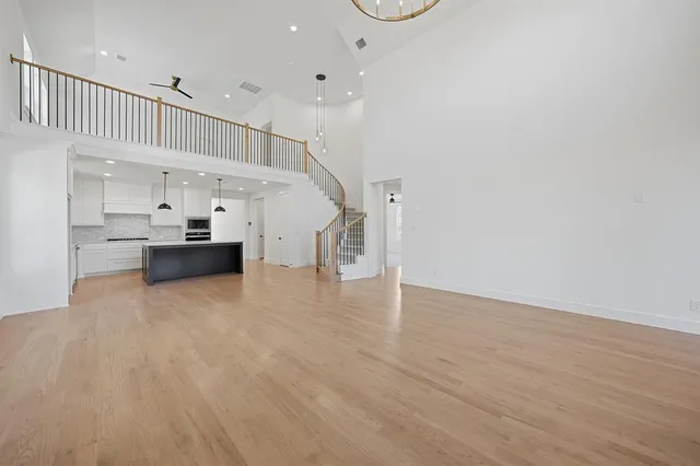 a view of kitchen with furniture and wooden floor
