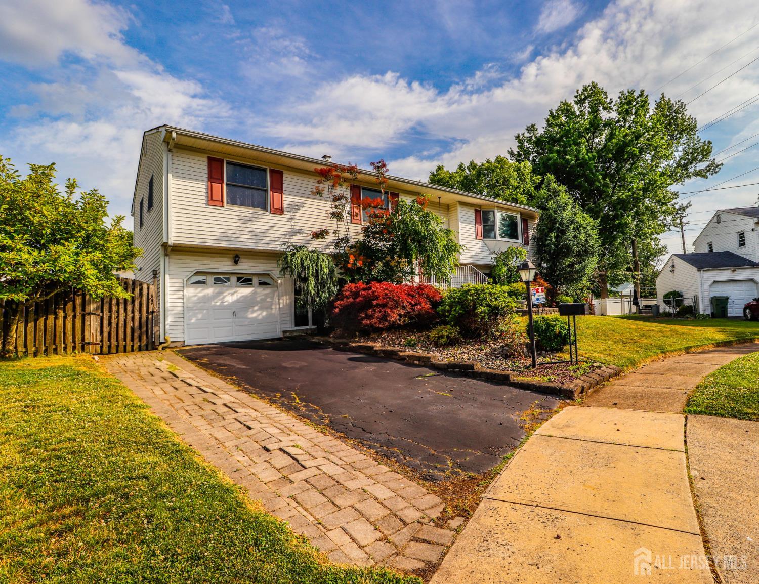 5 Timothy Court Edison, NJ 08837 - Photo 2 of 32 a front view of a house with a yard
