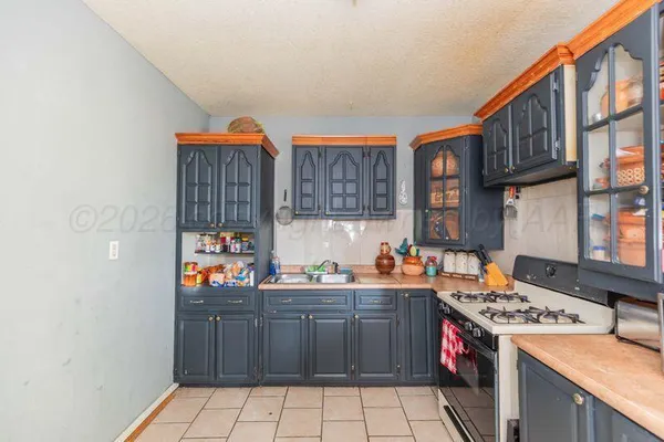 a bed room with a bed mirror and a window