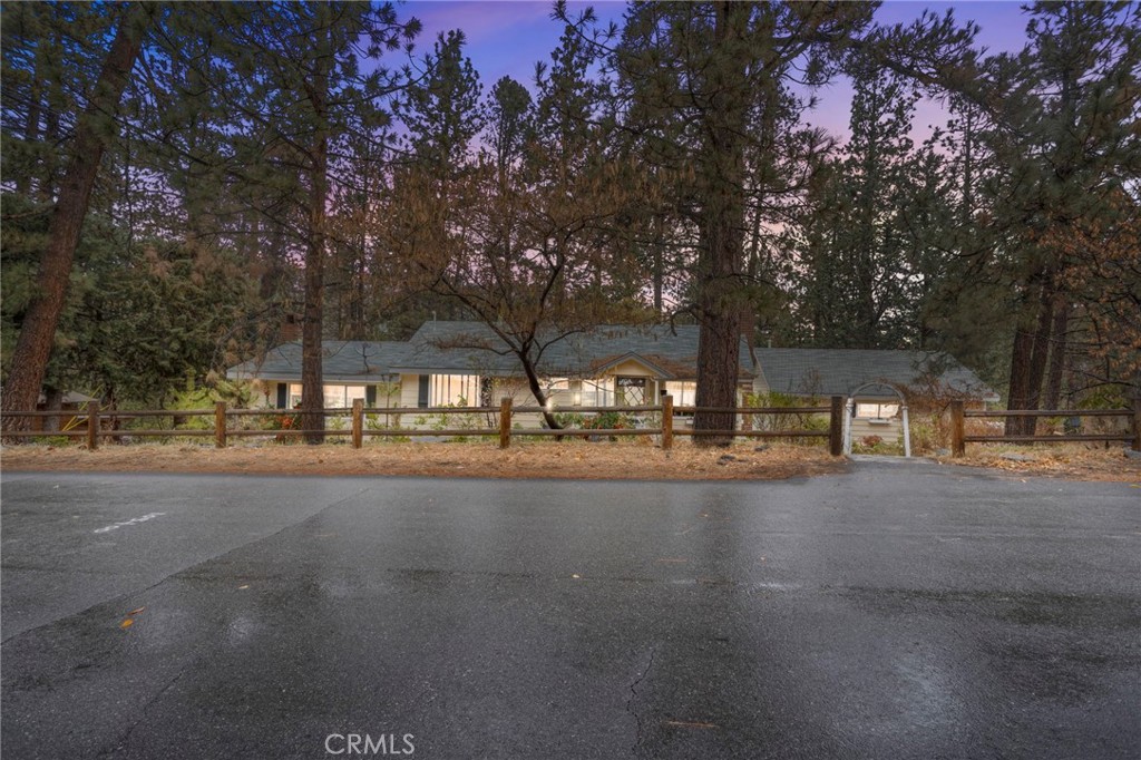 a view of a street with houses on both side of street