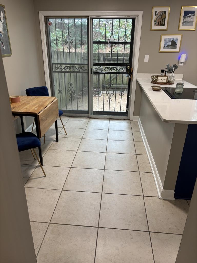 5726 Quince Road, Unit 2 Memphis, TN 38119 - Photo 6 of 7 Doorway with tile patterned flooring and baseboards