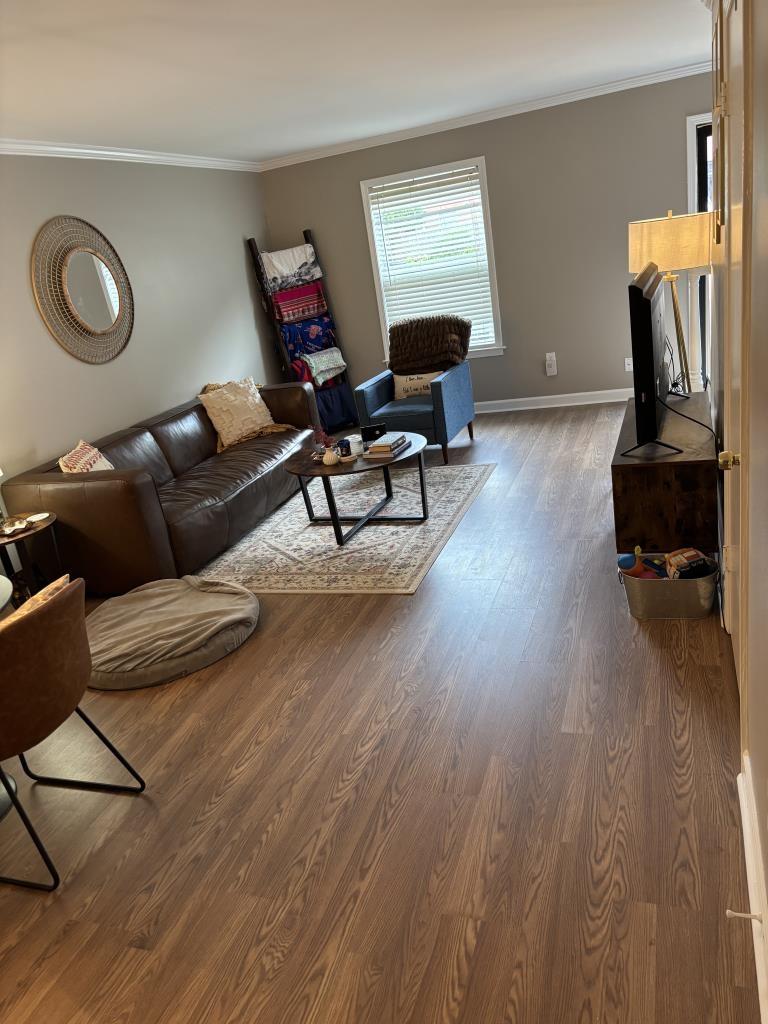 5726 Quince Road, Unit 2 Memphis, TN 38119 - Photo 7 of 7 Living area featuring ornamental molding and wood finished floors