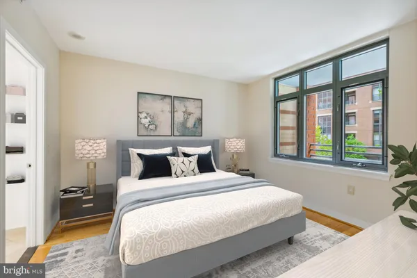 a bedroom with a large bed and a window