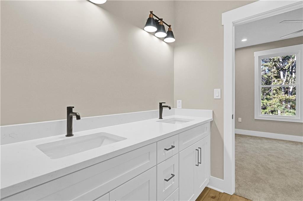507 North Ridge Road Barnesville, GA 30204 - Photo 4 of 21 a bathroom with a sink and a mirror