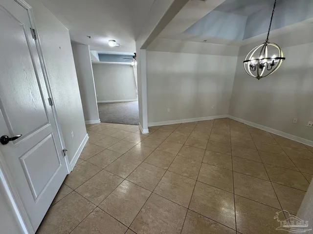 a view of a livingroom with wooden floor and door