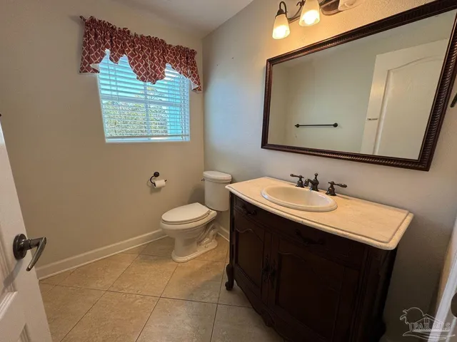 an empty room with a ceiling fan and window